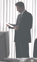 Insurance agent reviewing customer's insurance policy